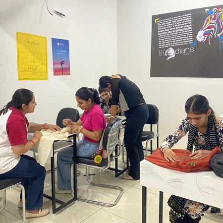 Students in a hands-on embroidery class