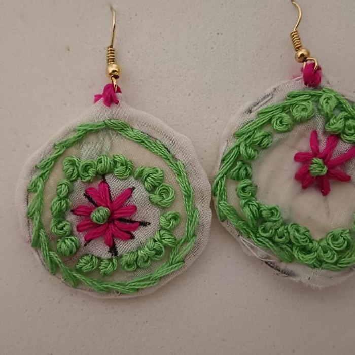 Handcrafted embroidered earrings by student